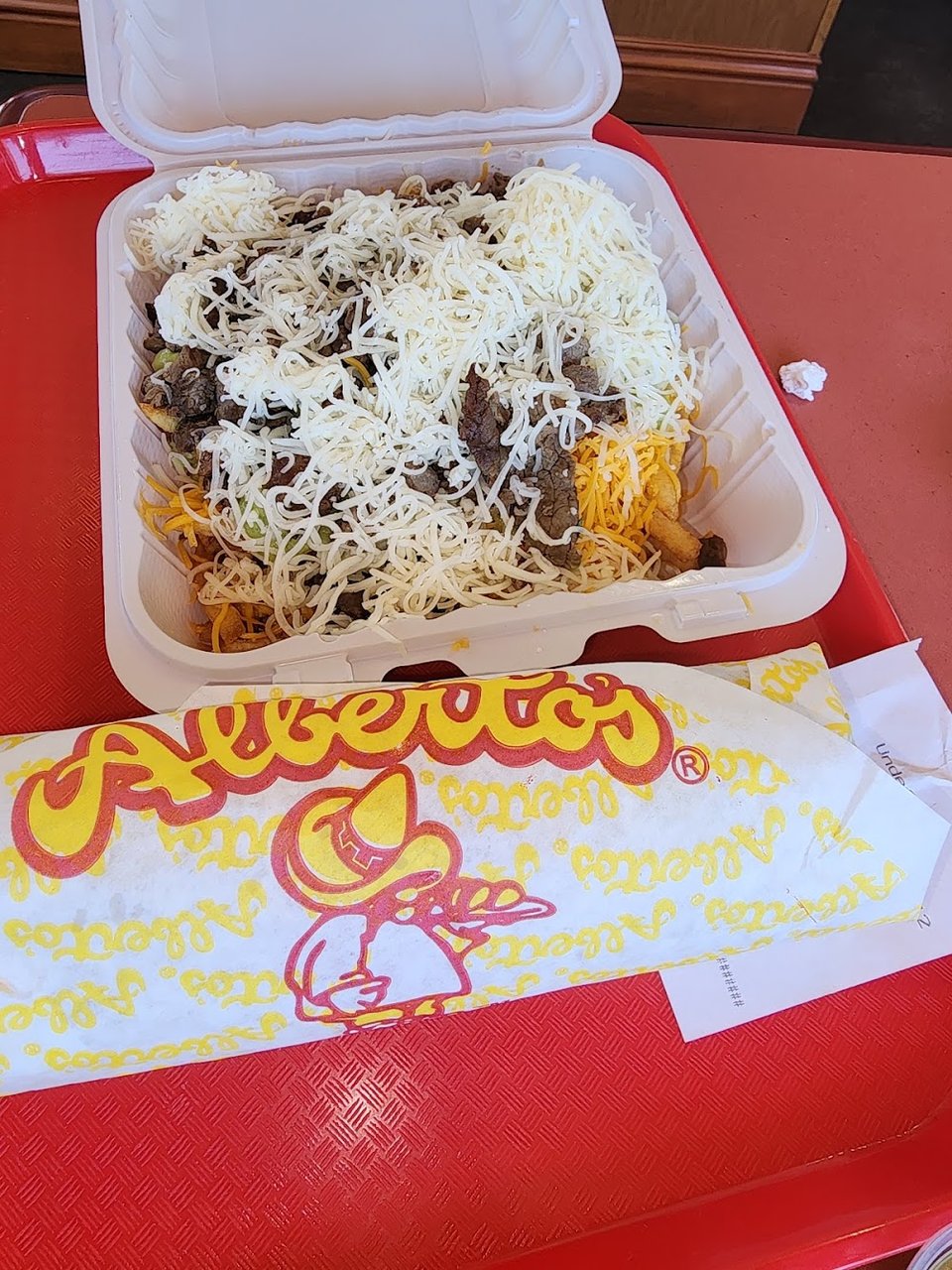 Printed menu showing combination plates and fries.