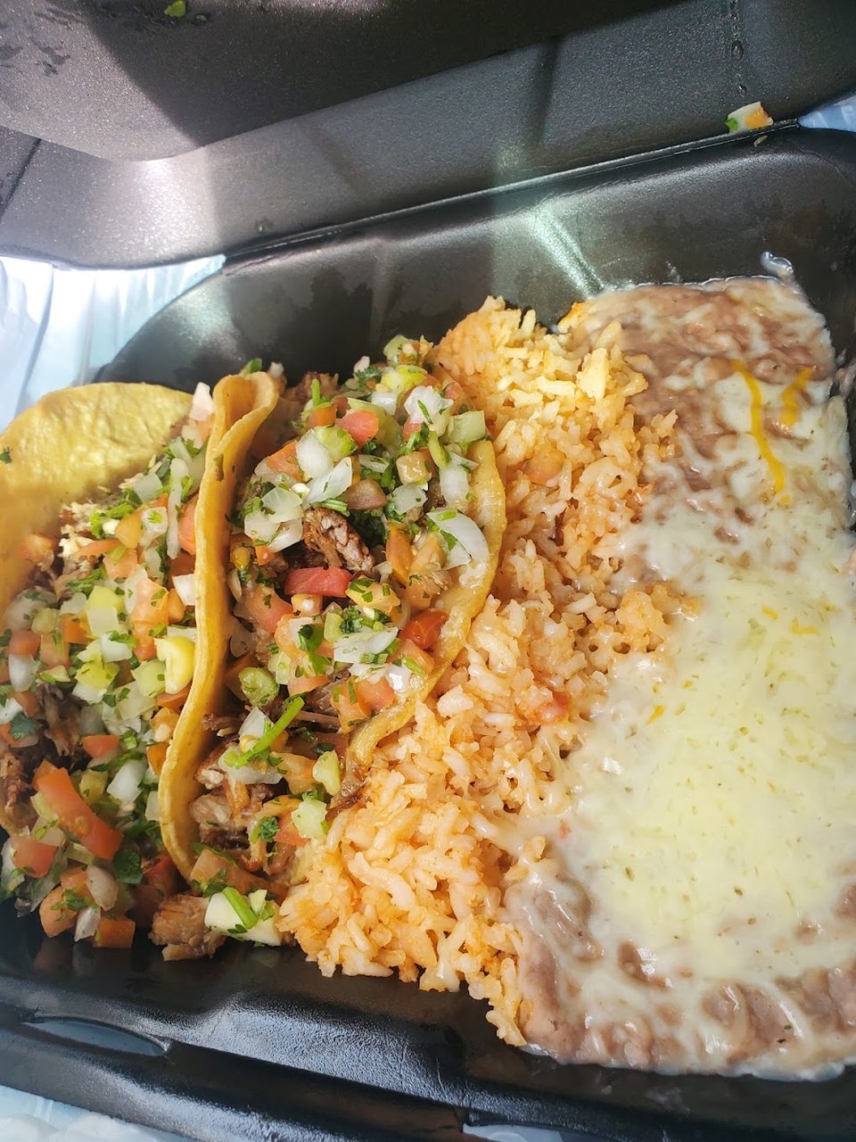 Menu display with burritos and tostadas.