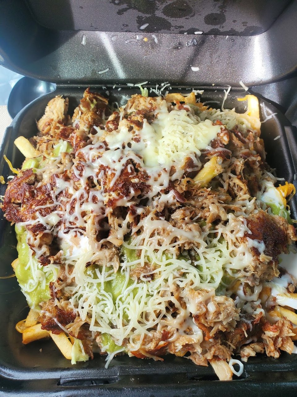 Menu board with burritos, tacos, and enchiladas.