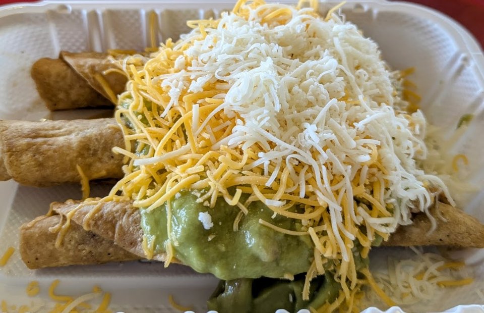 Menu display with burritos and tostadas.